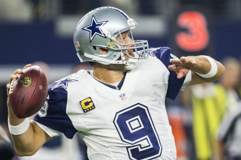 Dallas Cowboys quarterback Tony Romo (9) throws a pass during the first quarter of their...