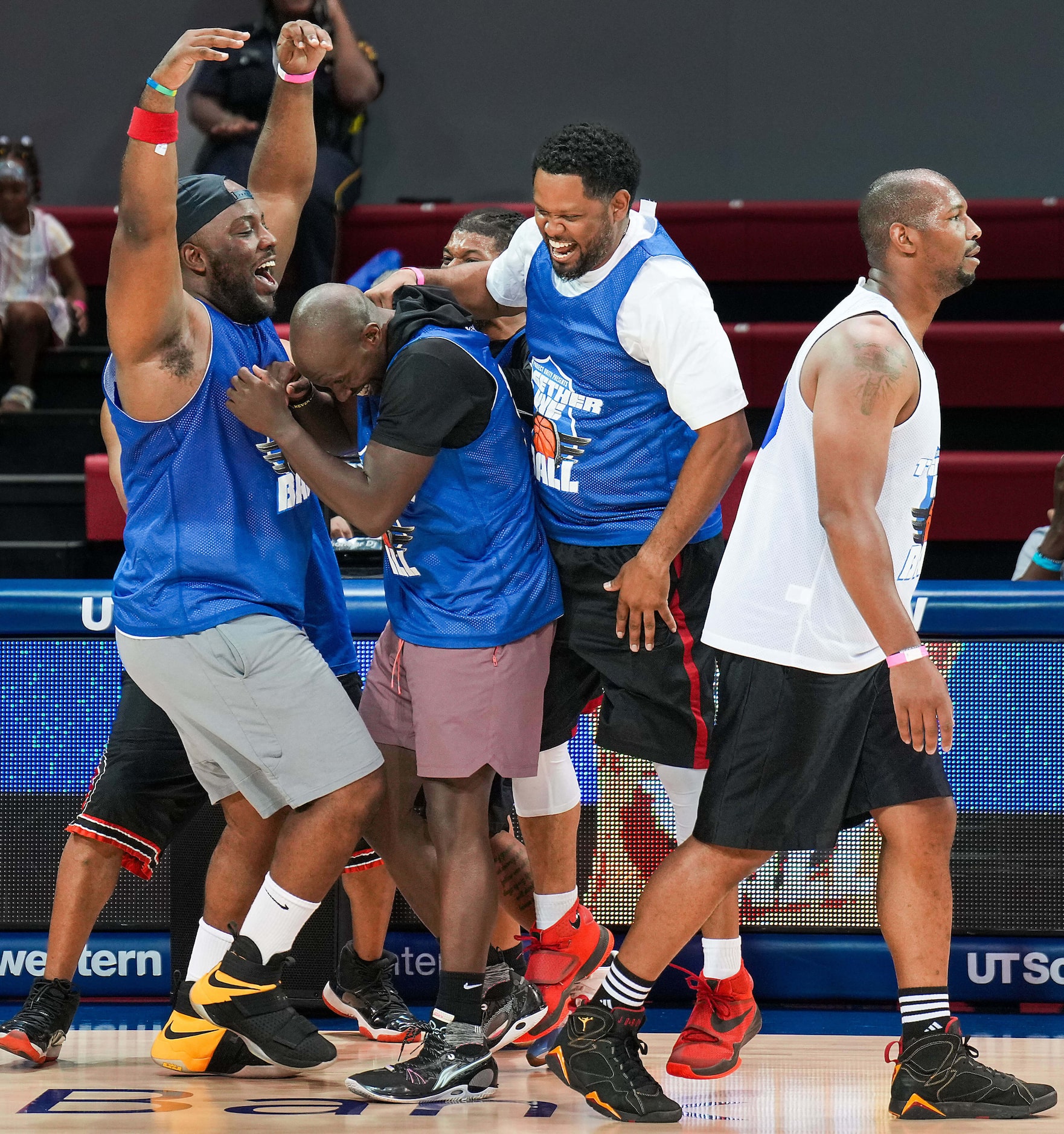 Dallas County Deputy Sheriff Jeremy Brown (center) is mobbed by his Blue teammates after...