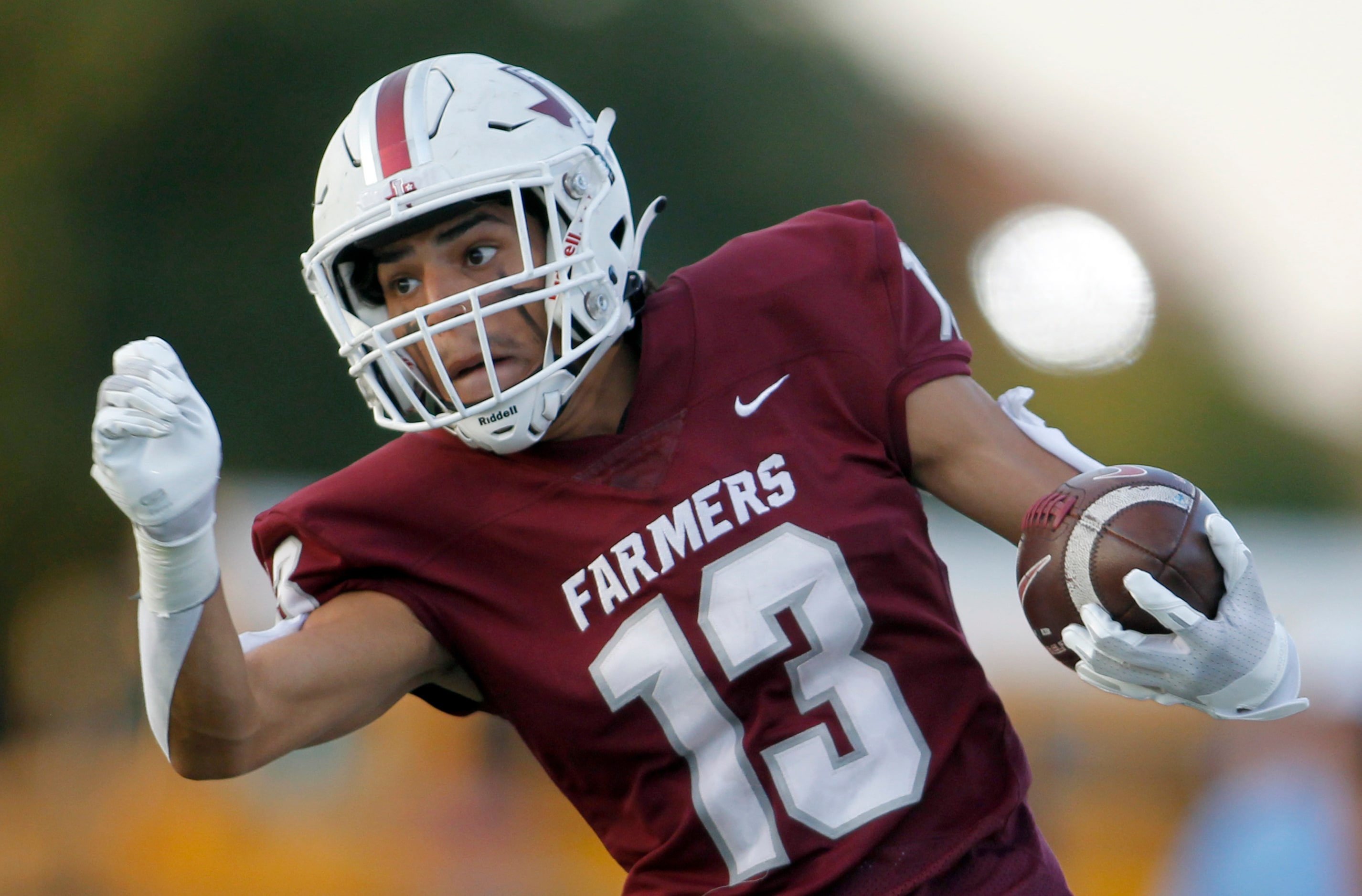 Lewisville receiver JJ Gonzales (13) makes a cut en route to his 60-yard touchdown reception...