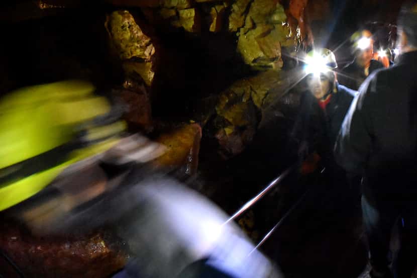 Visitors taking the more-than-five-hour Wild Tour rush past in Mammoth Cave.