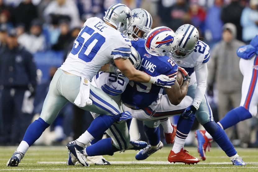 Buffalo Bills running back Karlos Williams (29) is brought down by Dallas Cowboys outside...