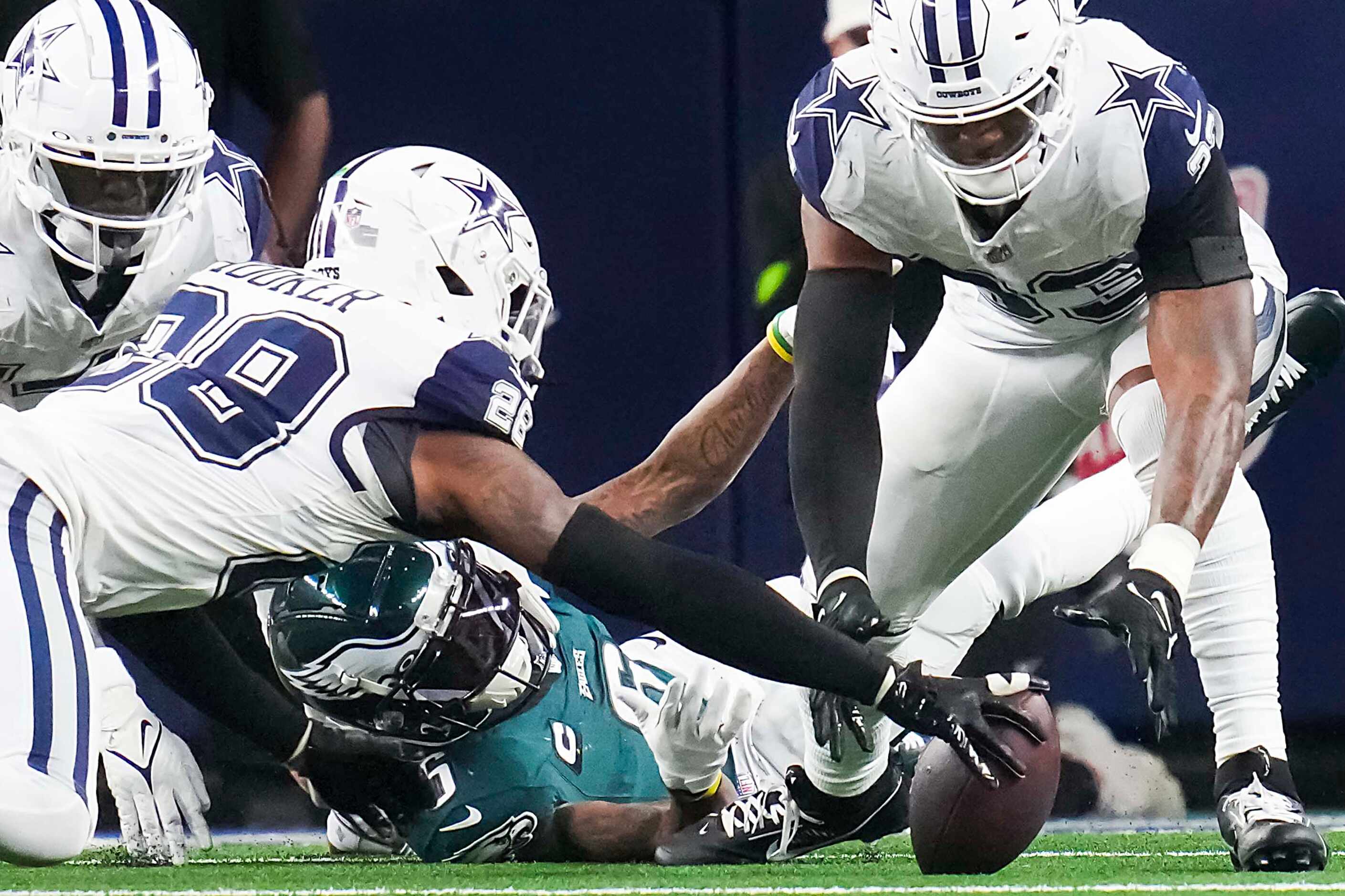 Dallas Cowboys safety Malik Hooker (28) recovers a fumble by Philadelphia Eagles wide...