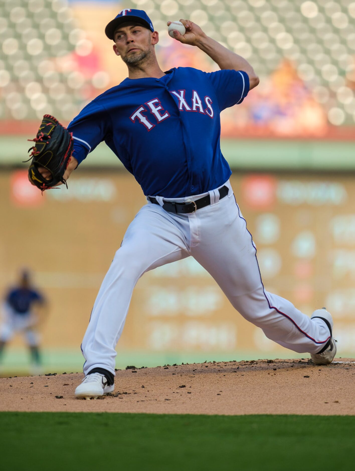 Texas Rangers starting pitcher Mike Minor delivers during the first inning against the...