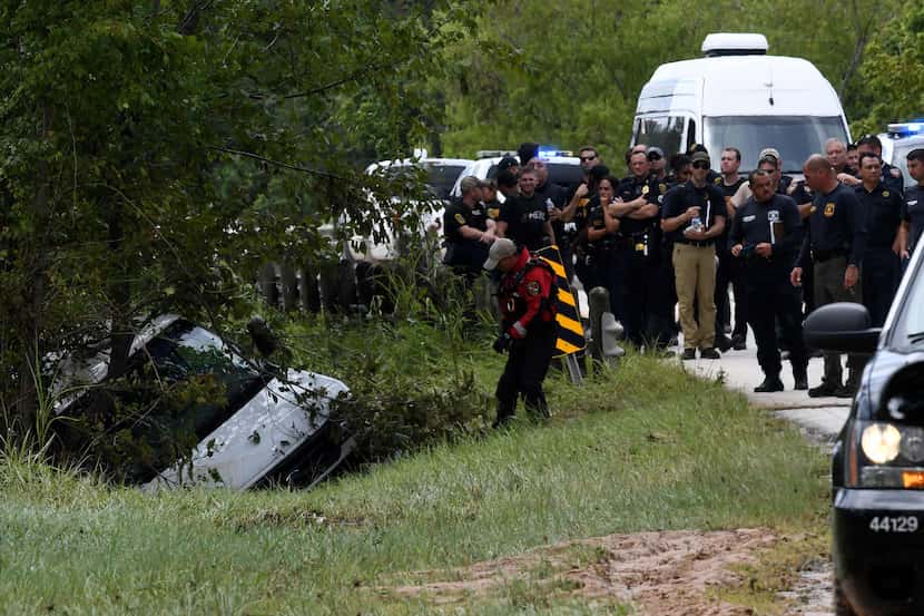 The van containing the bodies of six members of the Saldivar family is towed to the road....