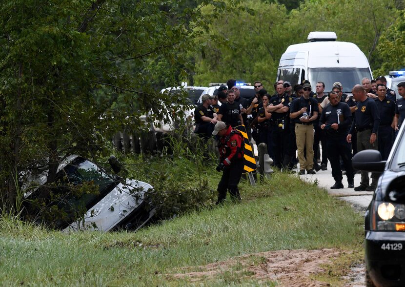 The van containing the bodies of six members of the Saldivar family is towed to the road....