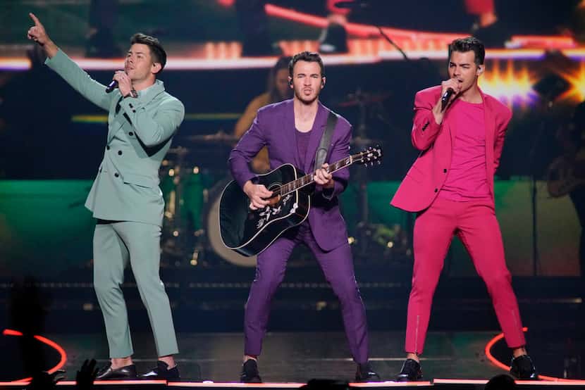 Nick Jonas, from left, Kevin Jonas and Joe Jonas, of the Jonas Brothers, perform during...