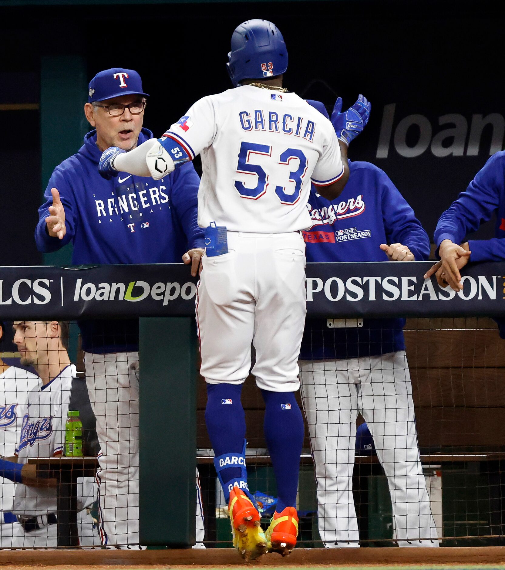 Texas Rangers Adolis Garcia (53) is congratulated on his second inning solo home run by...