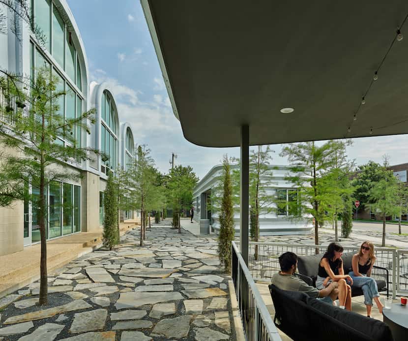 Flagstone pavers mark the PS1200 courtyard. The development's landscape design is by DIRT...