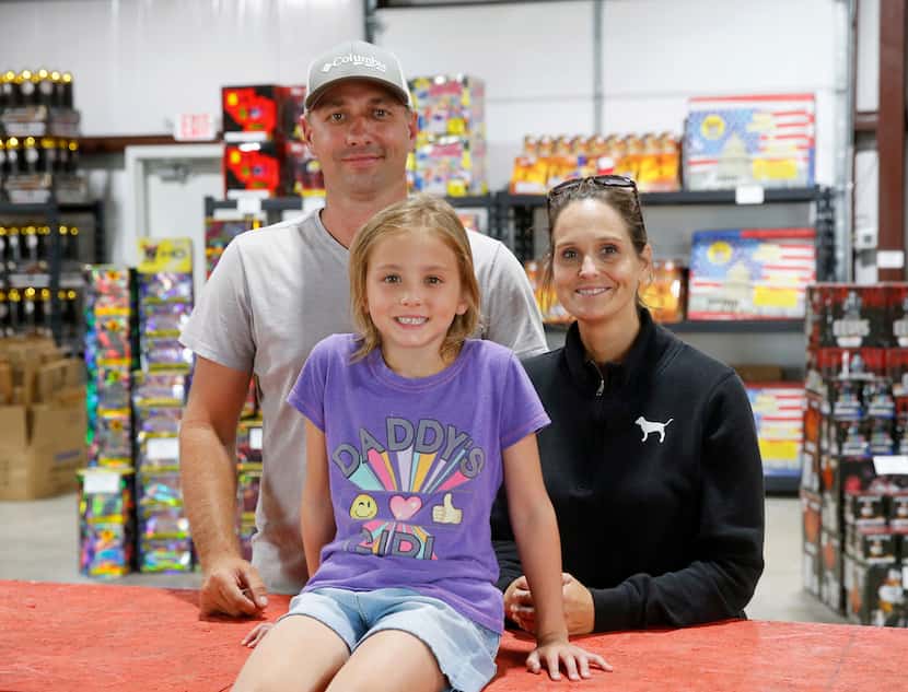 Jason, Jennifer, and 6-year-old Emma Sulc work at Big Bang Discount Fireworks in Kaufman...