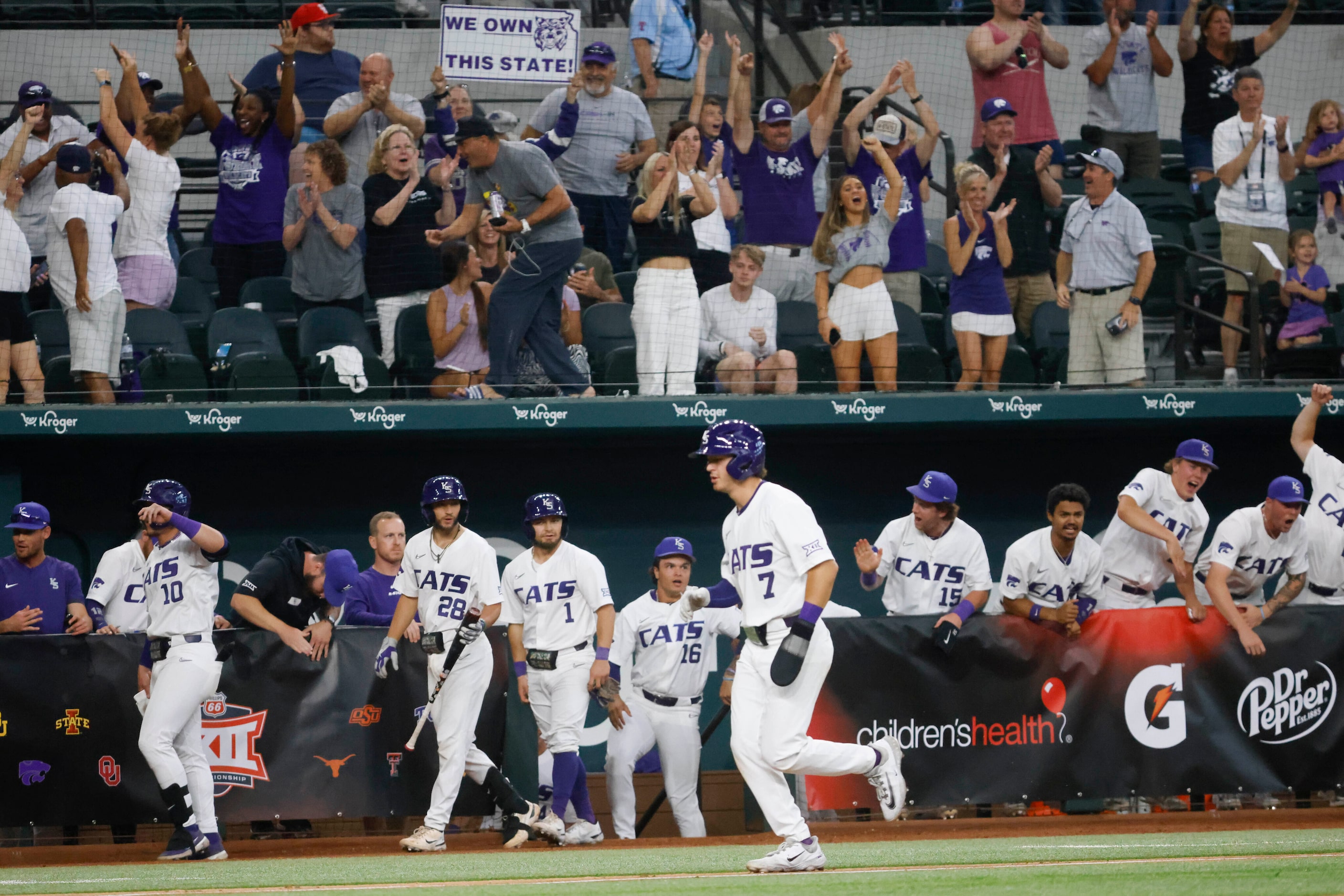 Players and fans react after a homer by Kansas St. infielder Kaelen Culpepper during the...