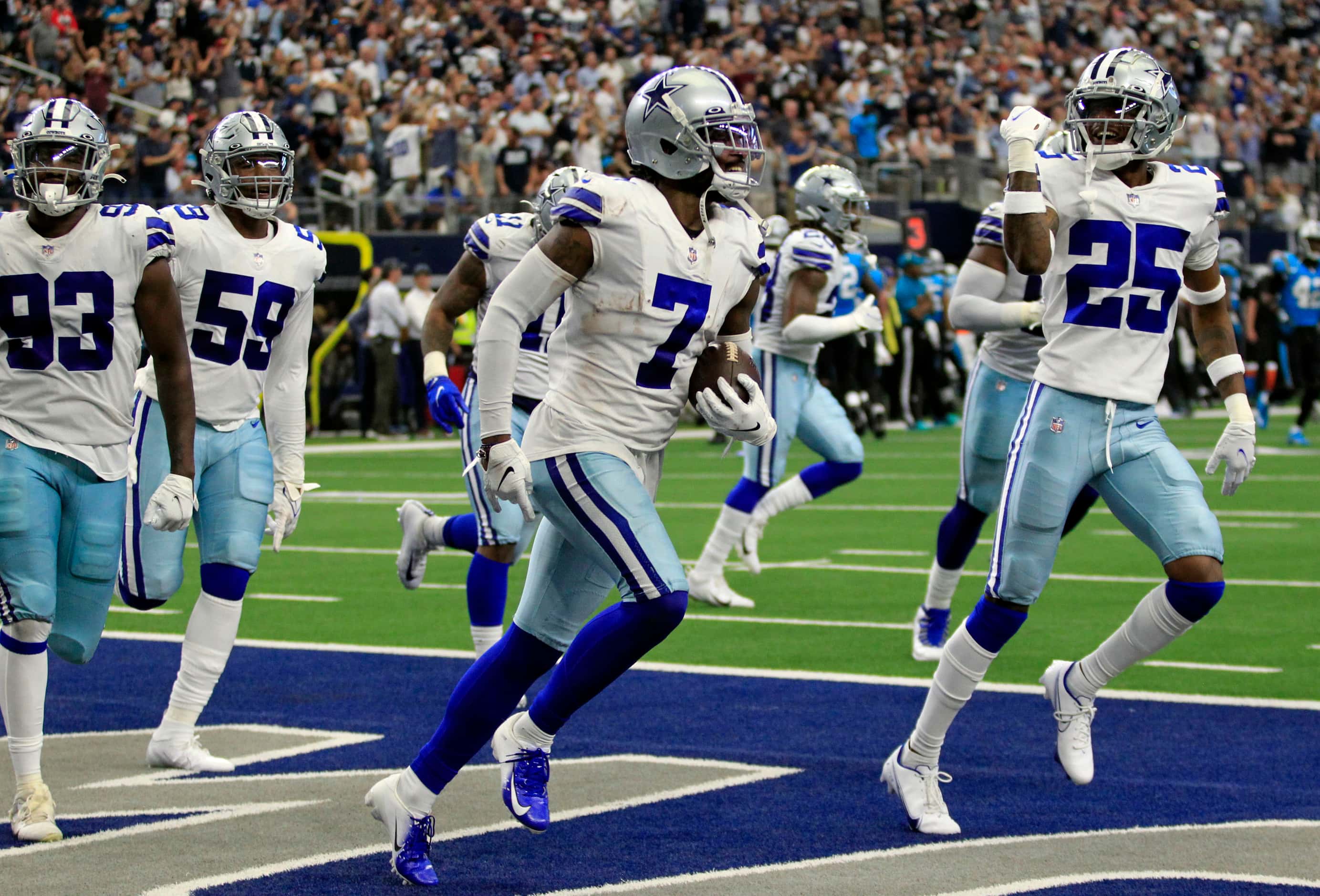 Dallas Cowboys cornerback Trevon Diggs (7) runs the field with teammates, after making a...