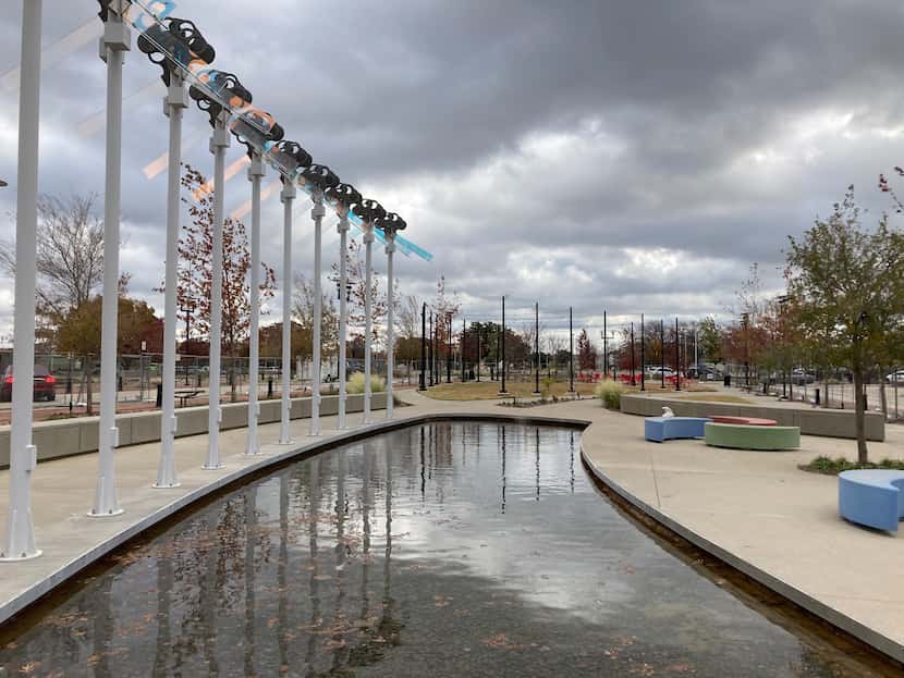 A 3-acre park connects commuter rail stations with building sites in Carrollton's Trinity...
