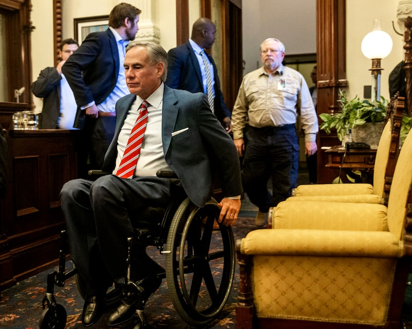 Gov. Greg Abbott, shown entering a May 18 news conference, is using his broad popularity...