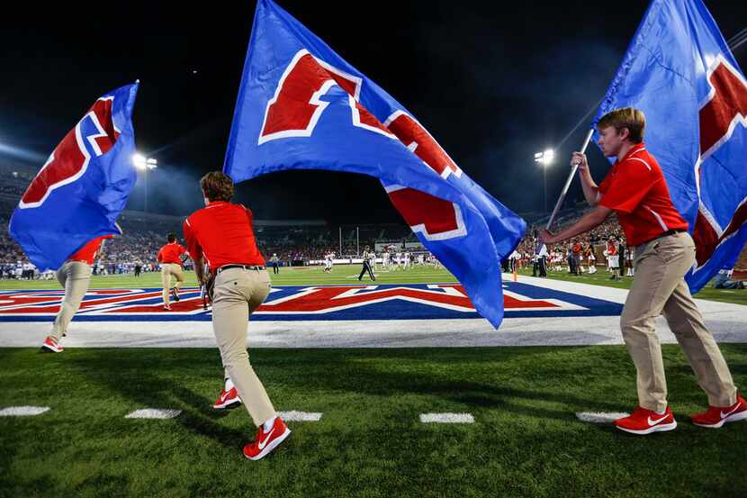 Southern Methodist Mustangs flags are flown after a touchdown during a matchup between the...