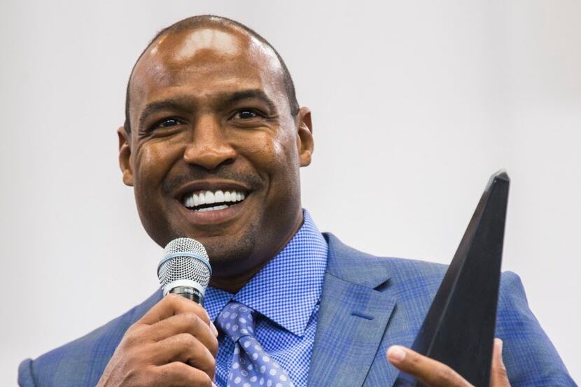 Former Dallas Cowboys safety Darren Woodson accepts the Tom Landry Legend Award during the...
