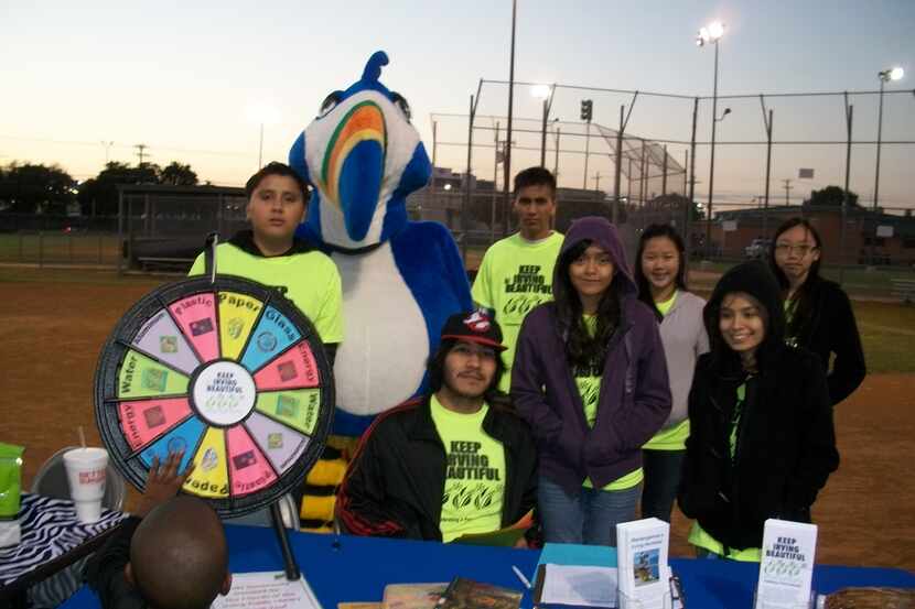 North Lake College volunteers and mascot Kirby run the Keep Irving Beautiful table at the...