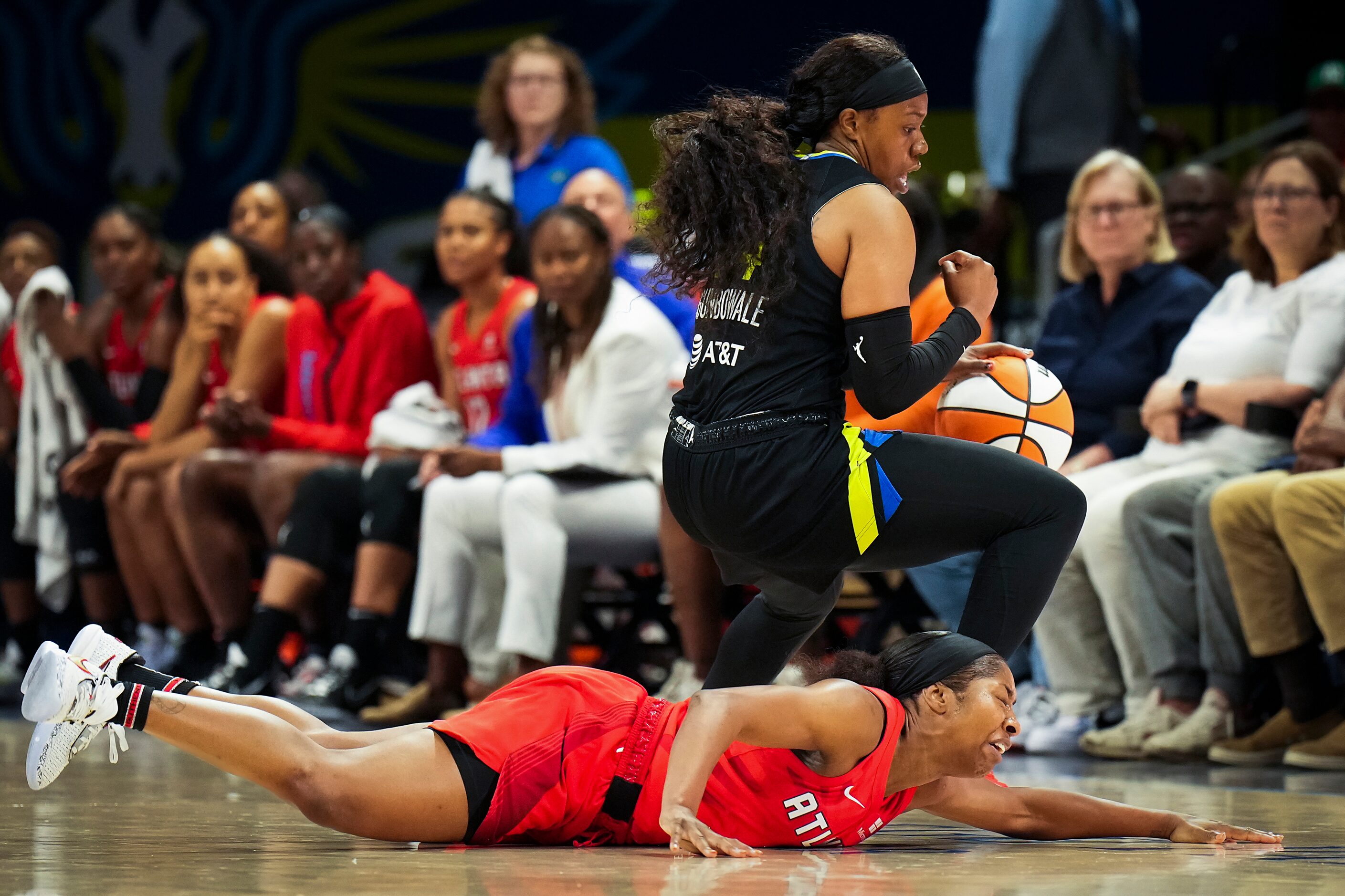 Dallas Wings guard Arike Ogunbowale (24) steals the ball from Atlanta Dream guard Aari...