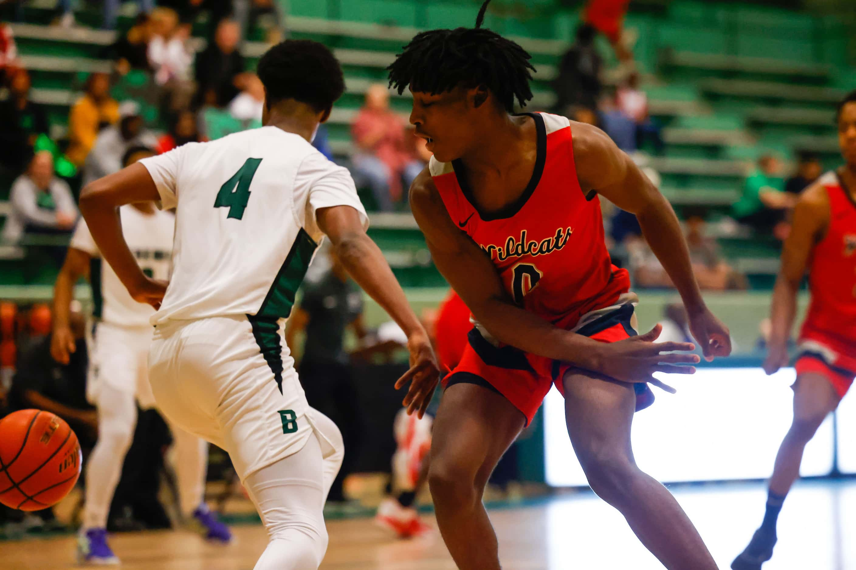 Lake Highlands High School' Jaylen Washington #0 blocks a pass from Berkner High School'...