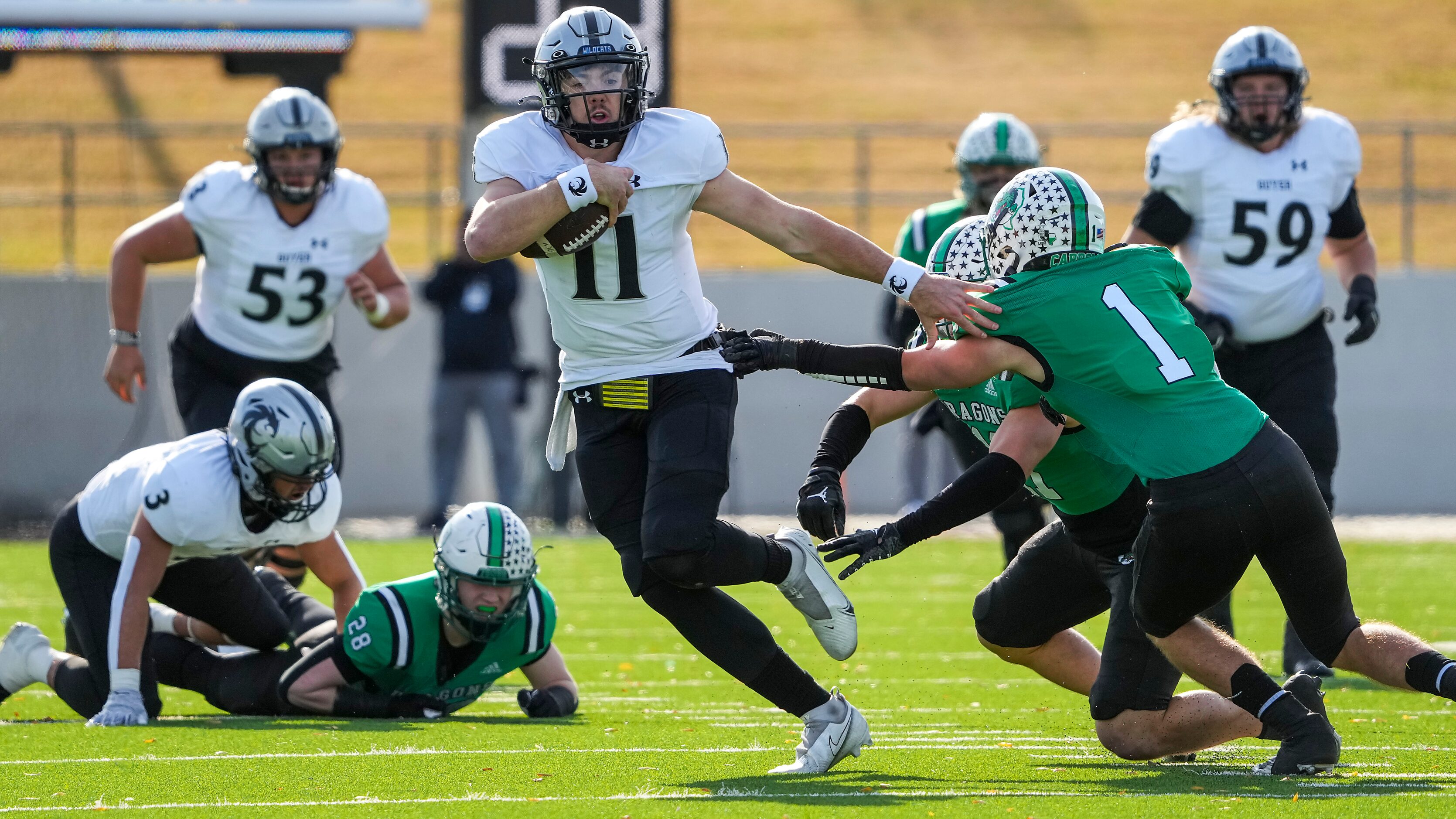 Denton Guyer quarterback Jackson Arnold (11) gets past Southlake Carroll defensive back...