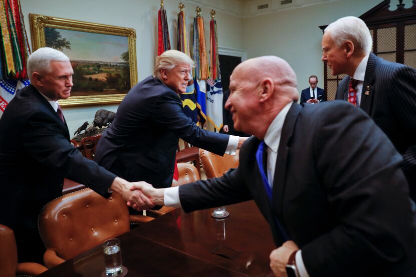 President Donald Trump and Vice President Mike Pence greet Rep. Kevin Brady, R-Texas,...