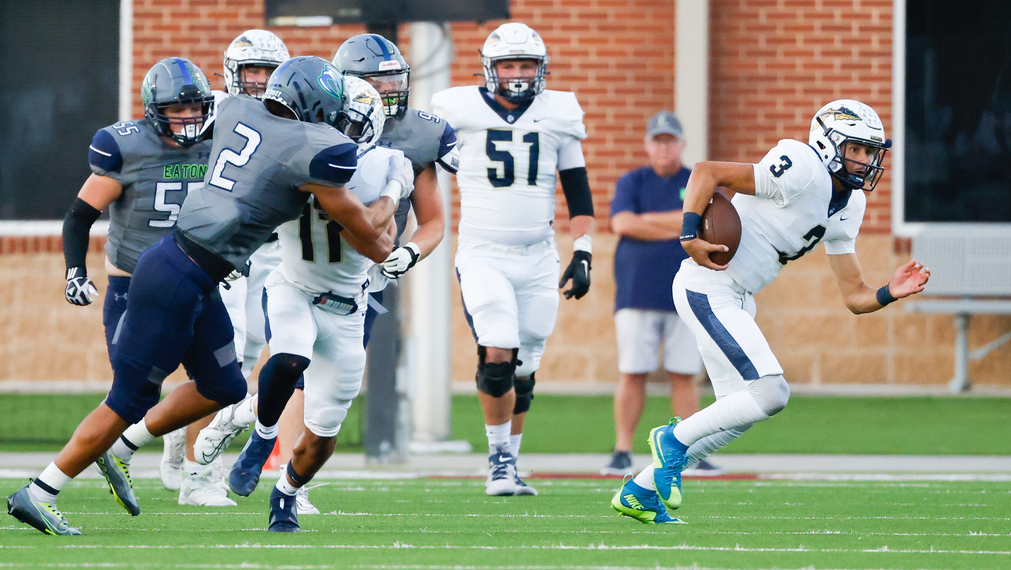 Keller High School quarterback Tre Guerra (3) moves toward the sideline as he carries the...