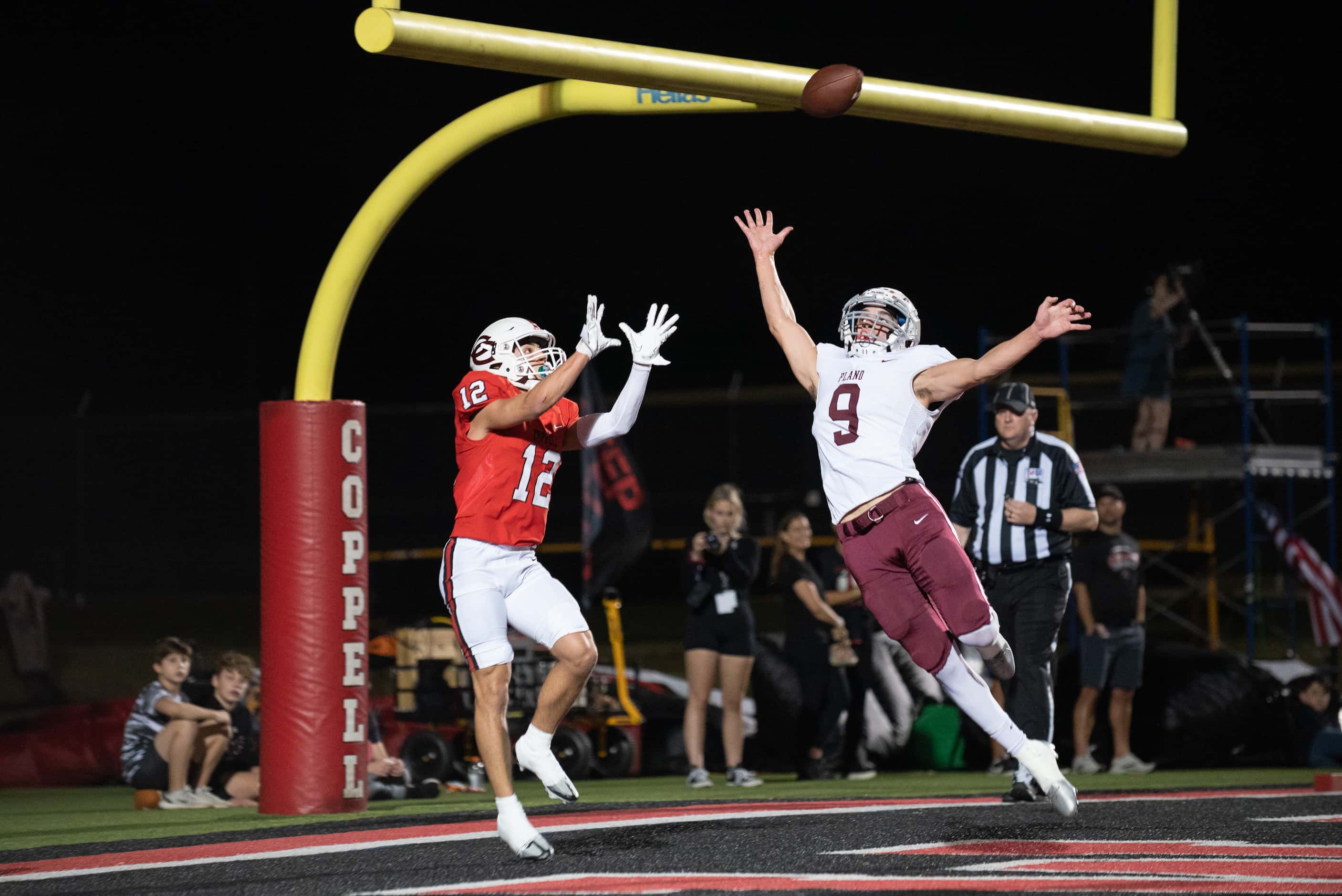 Coppell junior wide receiver Luca Grosoli (12)  prepares to catch a touchdown pass while...