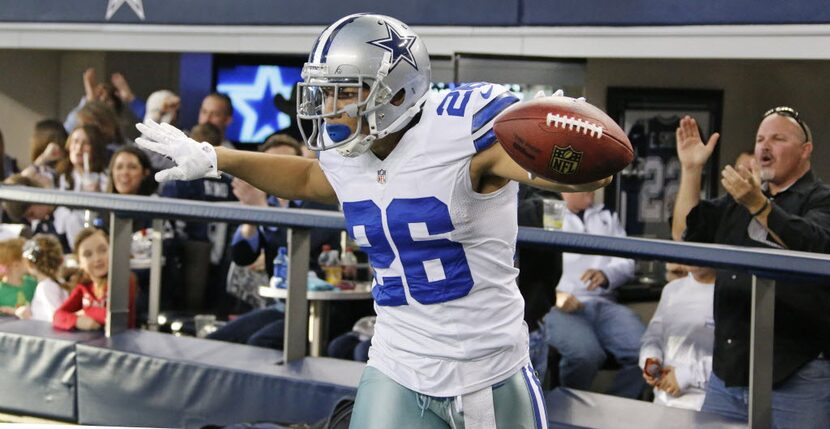 Dallas Cowboys defensive back Sterling Moore (26) celebrates with fans after his...