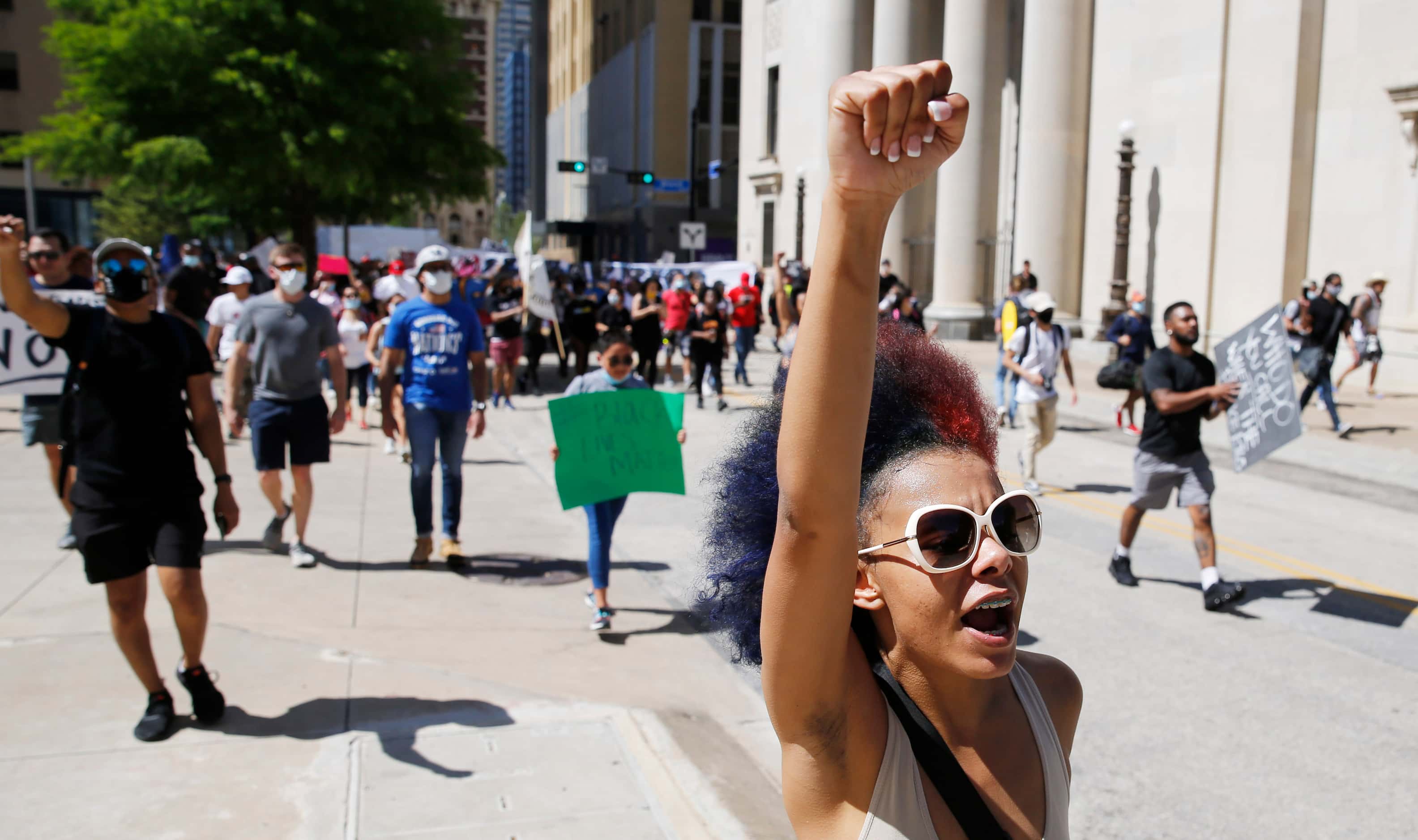 Protesters march against police brutality in downtown Dallas, on Saturday, May 30, 2020....
