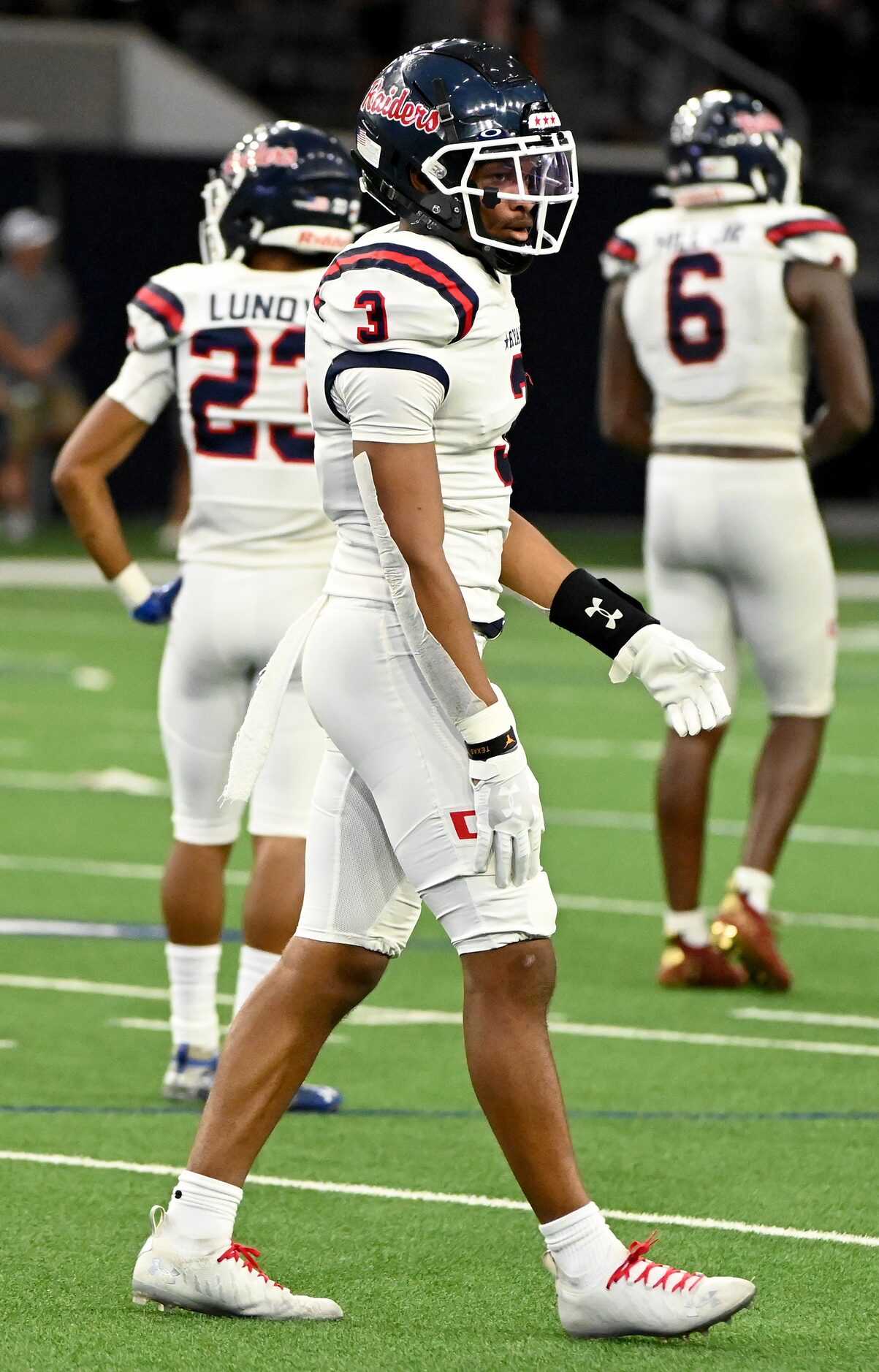 Denton Ryan’s Austin Jordan between plays in the second half during a high school football...