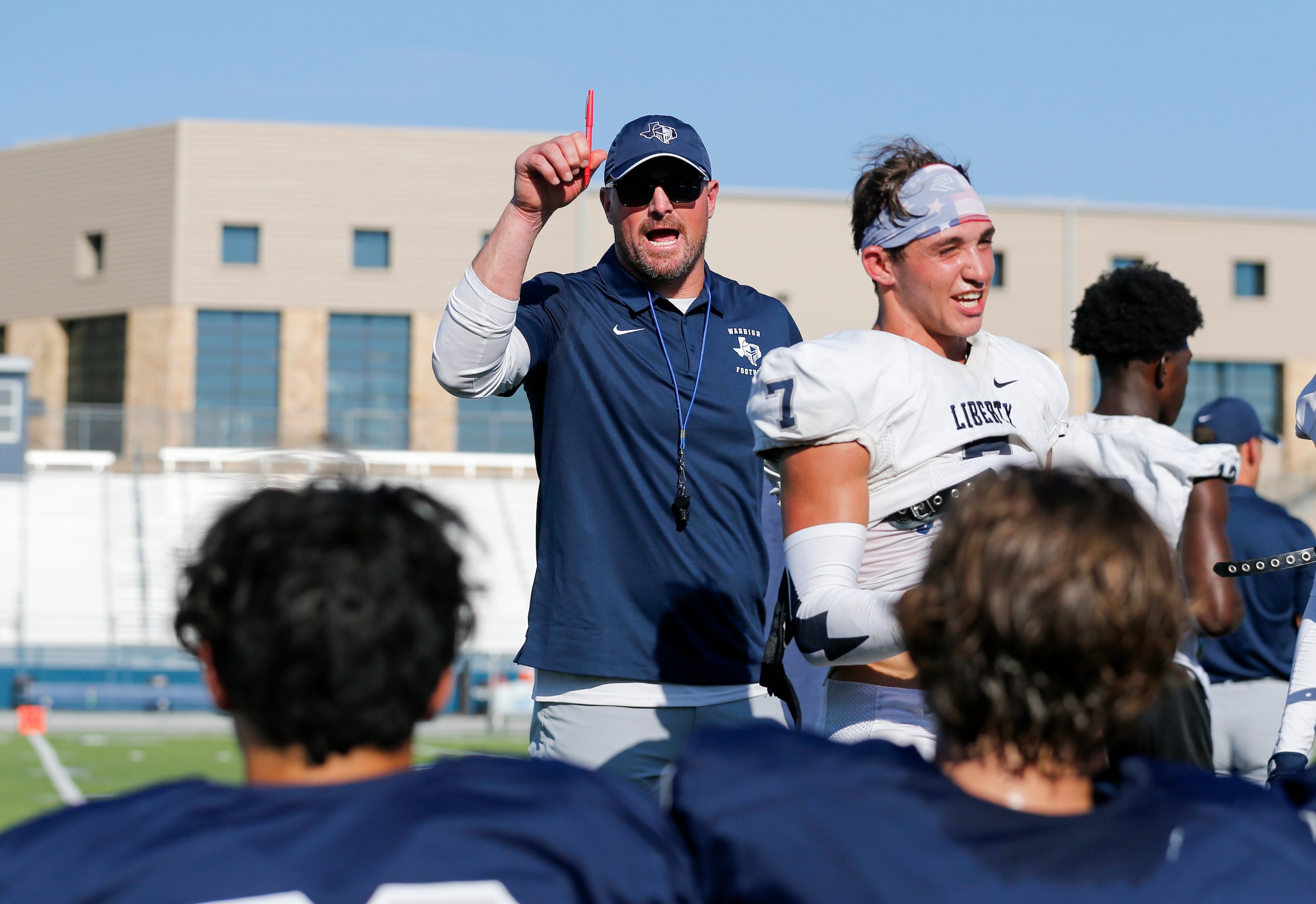 Argyle Liberty Christian head coach Jason Witten speaks to players during a football...