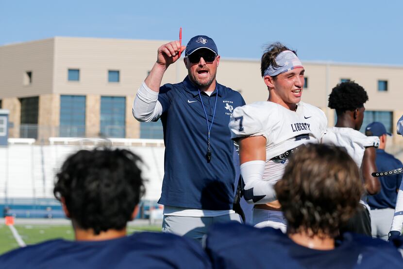 Argyle Liberty Christian head coach Jason Witten speaks to players during a football...