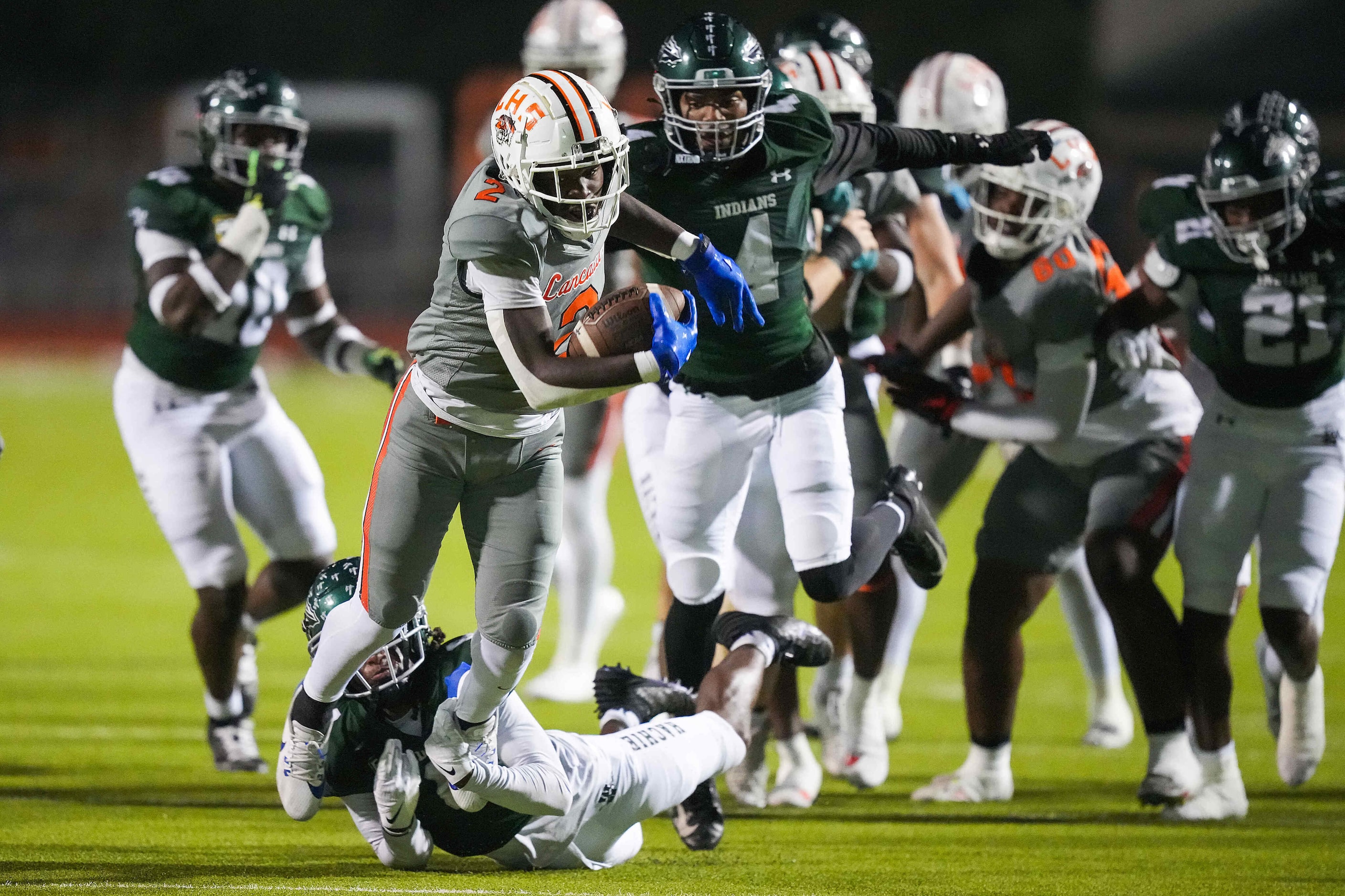 Lancaster running back Izayah Lee (2) breaks through the Waxahachie defense during the first...