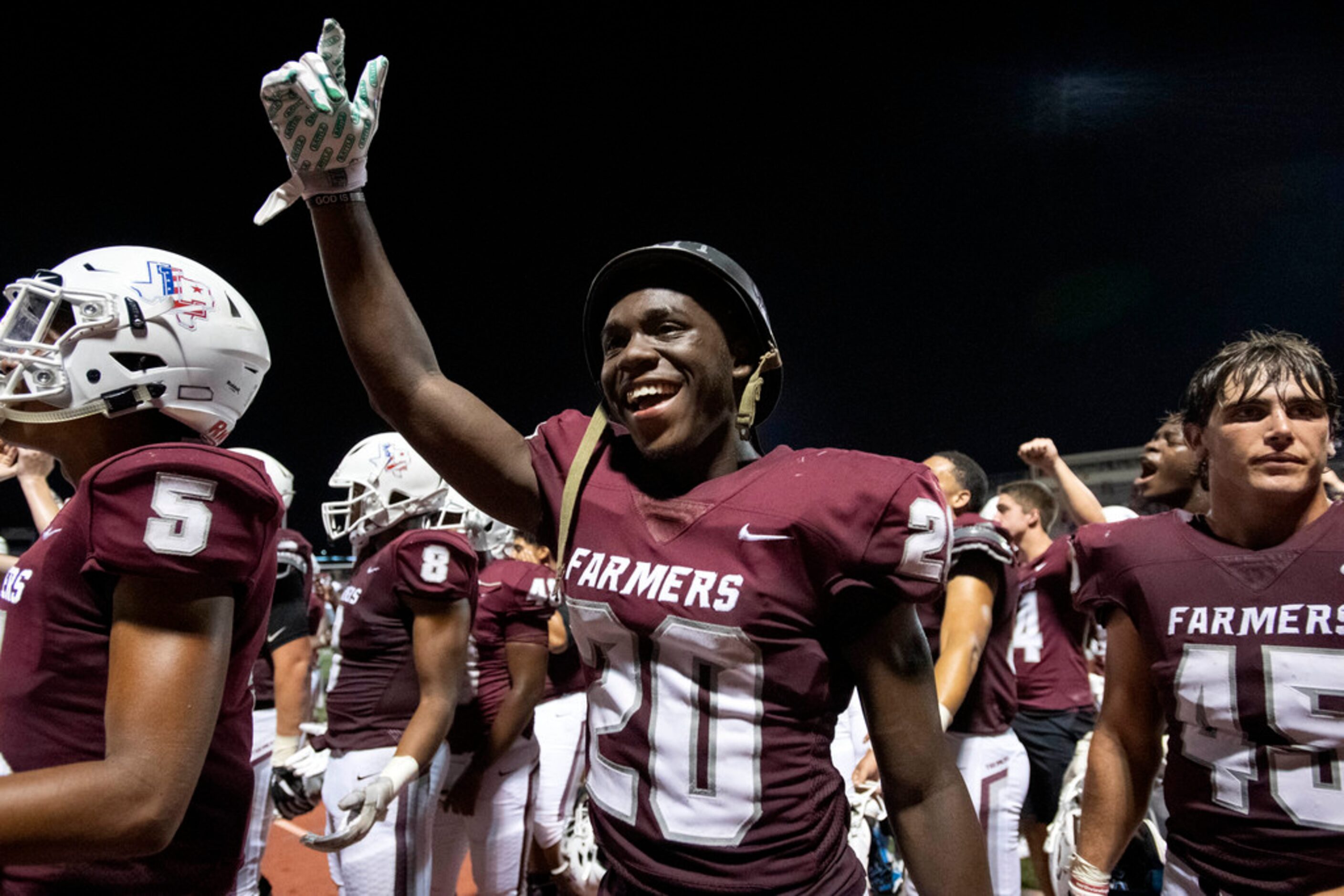 Lewisville junior Keegan Brewer (20), who recovered a fumble in the first half, celebrates...