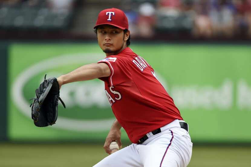 Texas Rangers starting pitcher Yu Darvish (11) pitches against the Minnesota Twins during...