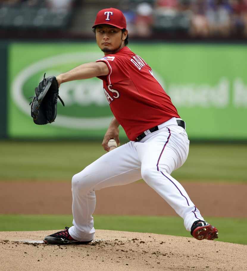 Texas Rangers starting pitcher Yu Darvish (11) pitches against the Minnesota Twins during...