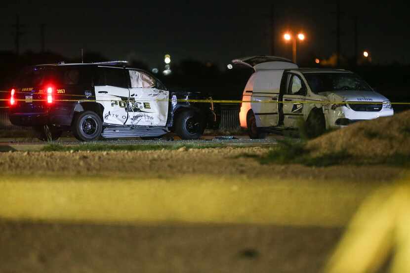A crashed U.S. Postal Service vehicle and Odessa Police vehicle are seen Saturday, Aug. 31,...