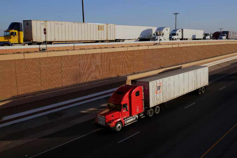 Trucks move along Interstate 35, in Laredo, Texas in November. Donald Trump's campaign...