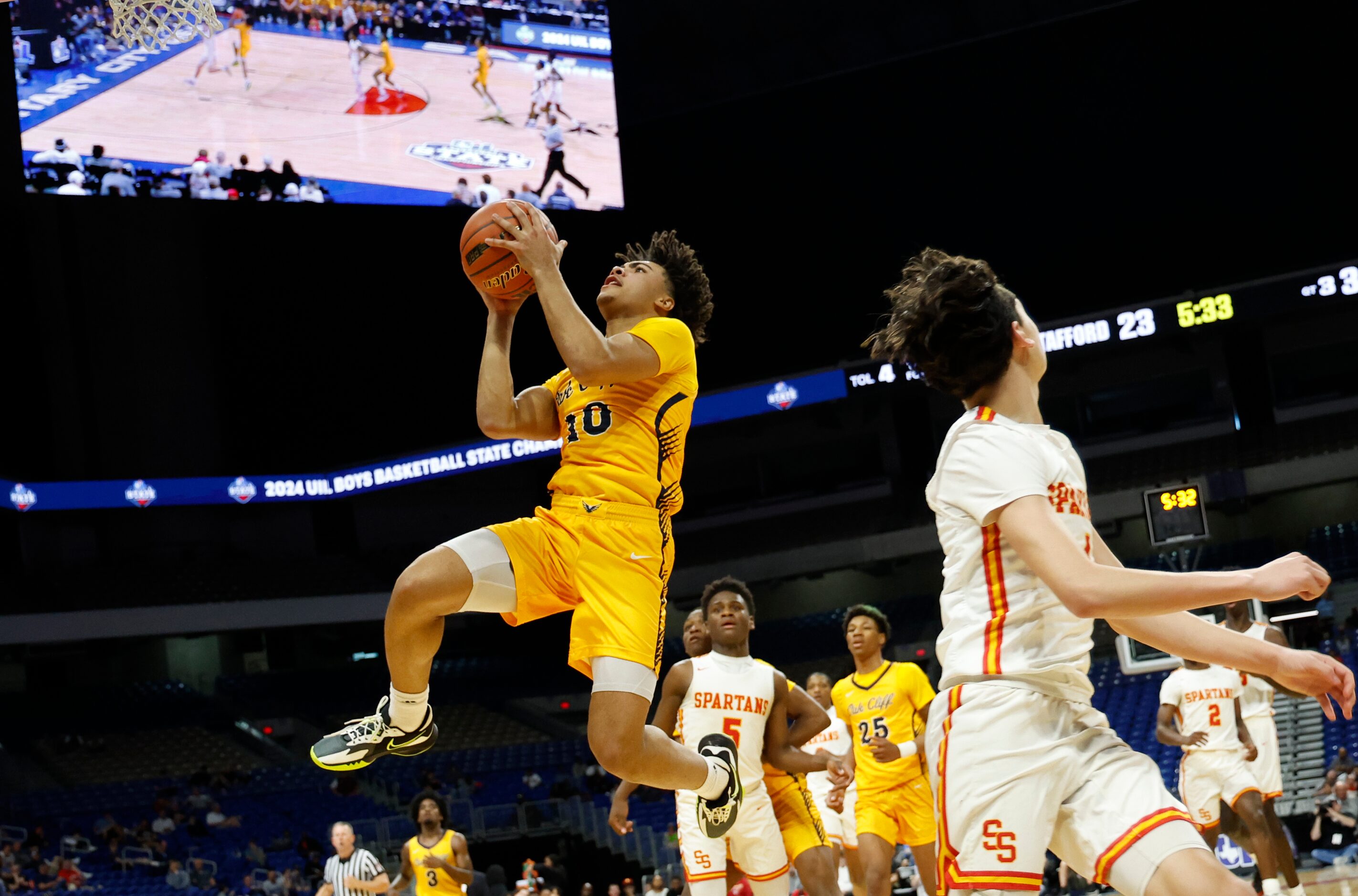 Faith Family's Isaac Williams (10) goes up for a shot against Stafford in the first half of...