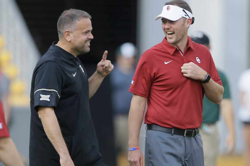 FILE - In this Sept. 23, 2017, file photo, Baylor head coach Matt Rhule, left, and Oklahoma...