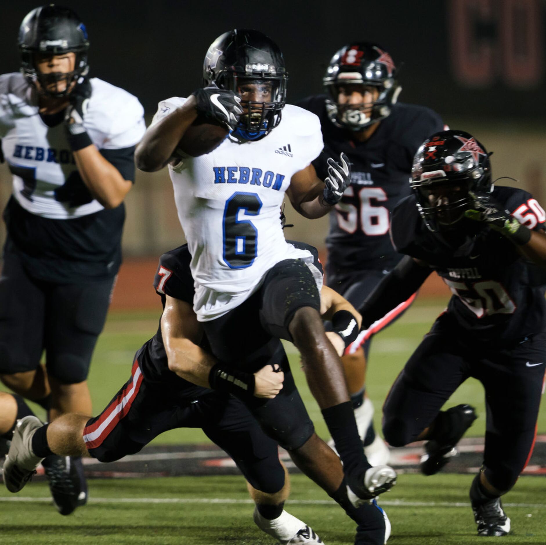 Hebron running back Jaylon Lott (6) breaks through the Coppell defense during the second...