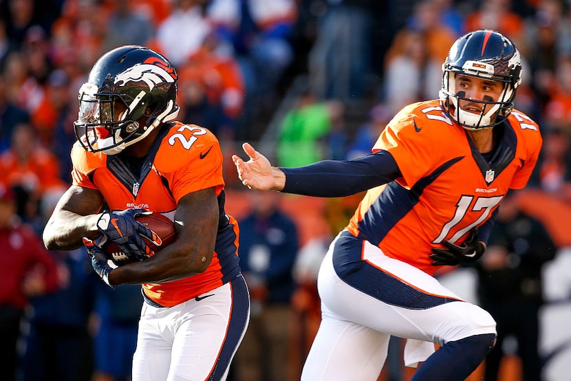 DENVER, CO - JANUARY 3:  Quarterback Brock Osweiler #17 of the Denver Broncos hands off to...