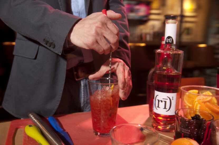 Bartender Jonathan Knecht, 30, mixes a Sazerac, a cocktail invented and made famous in New...