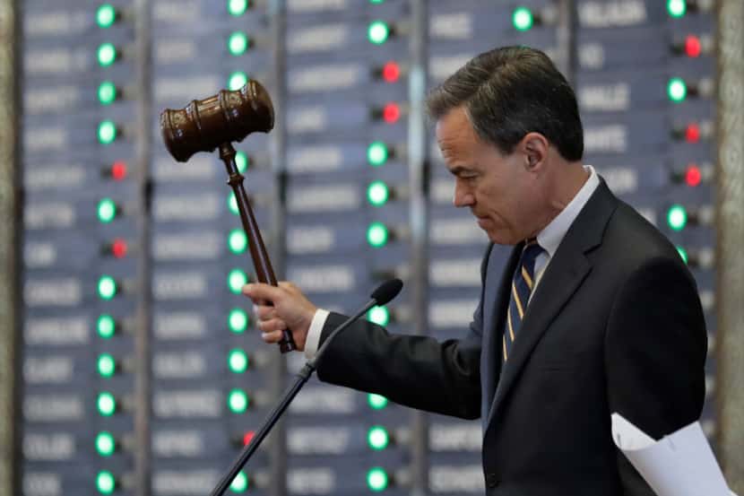 Texas Speaker of the House Joe Straus, R-San Antonio, strikes his gavel during debates in...