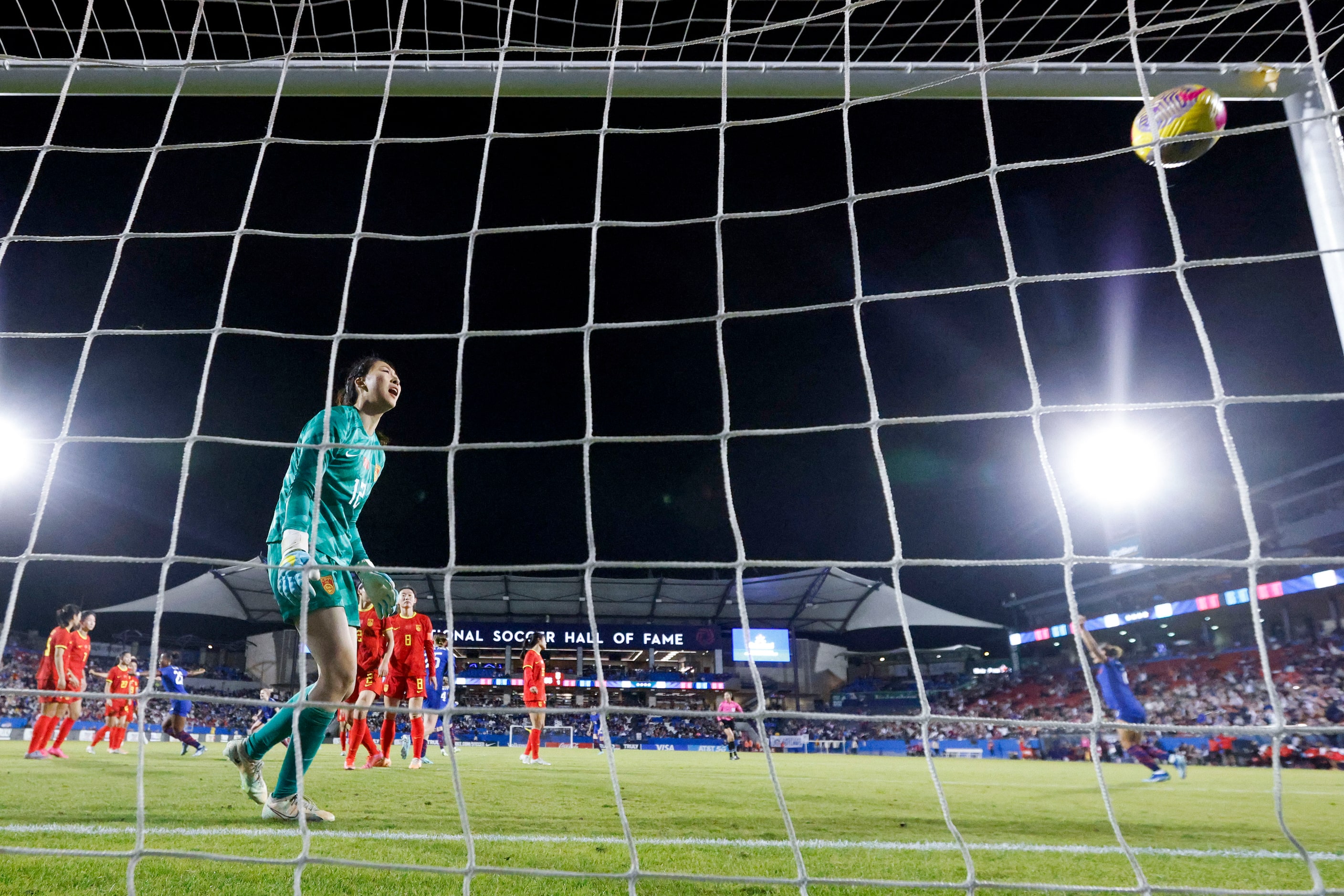 China’s goalkeeper Xu Huan (left) reacts as she watches the goal scored by United States’...