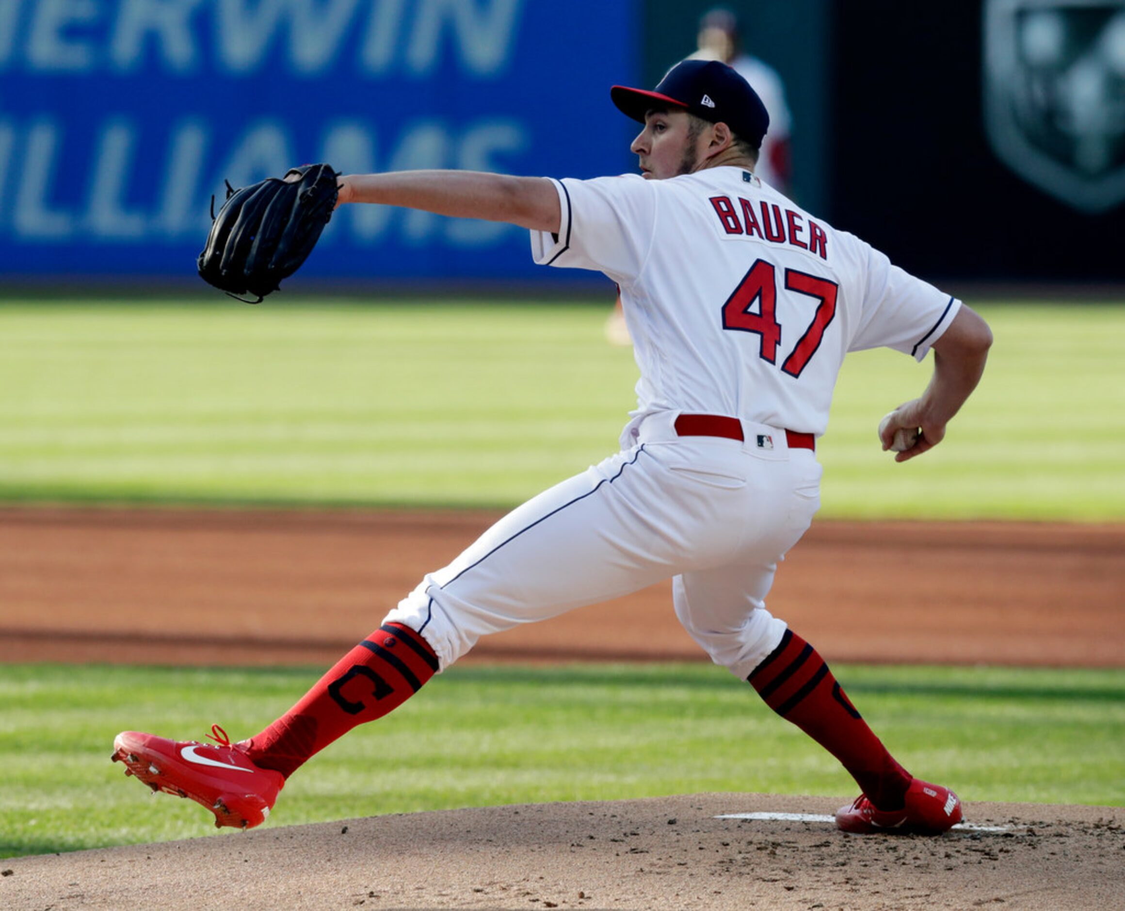 Cleveland Indians starting pitcher Trevor Bauer delivers in the first inning of a baseball...