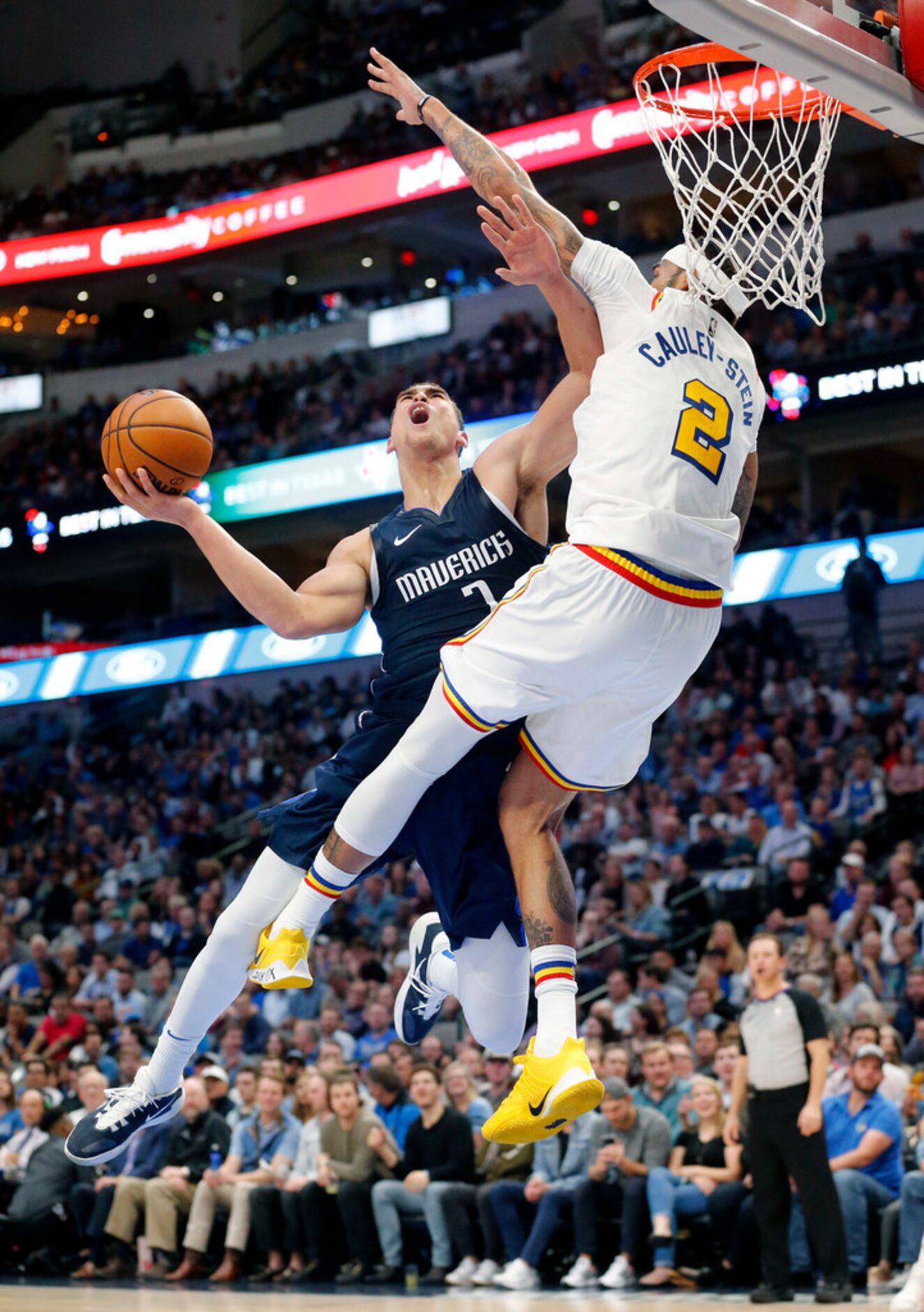 Dallas Mavericks forward Dwight Powell (7) draws the foul as he puts up a second quarter...