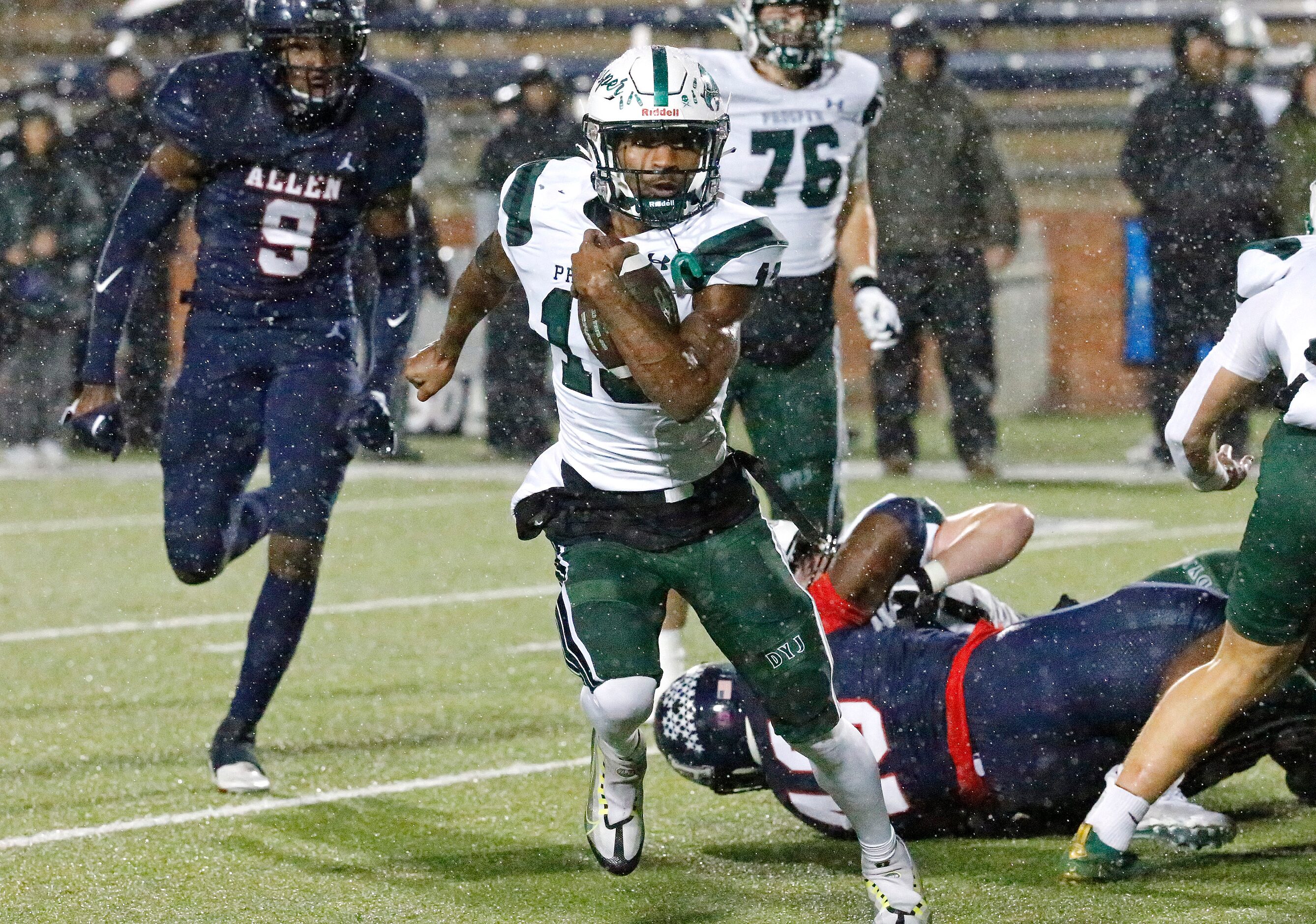 Prosper High School running back Prentice Sanders (13) runs the ball during the first half...