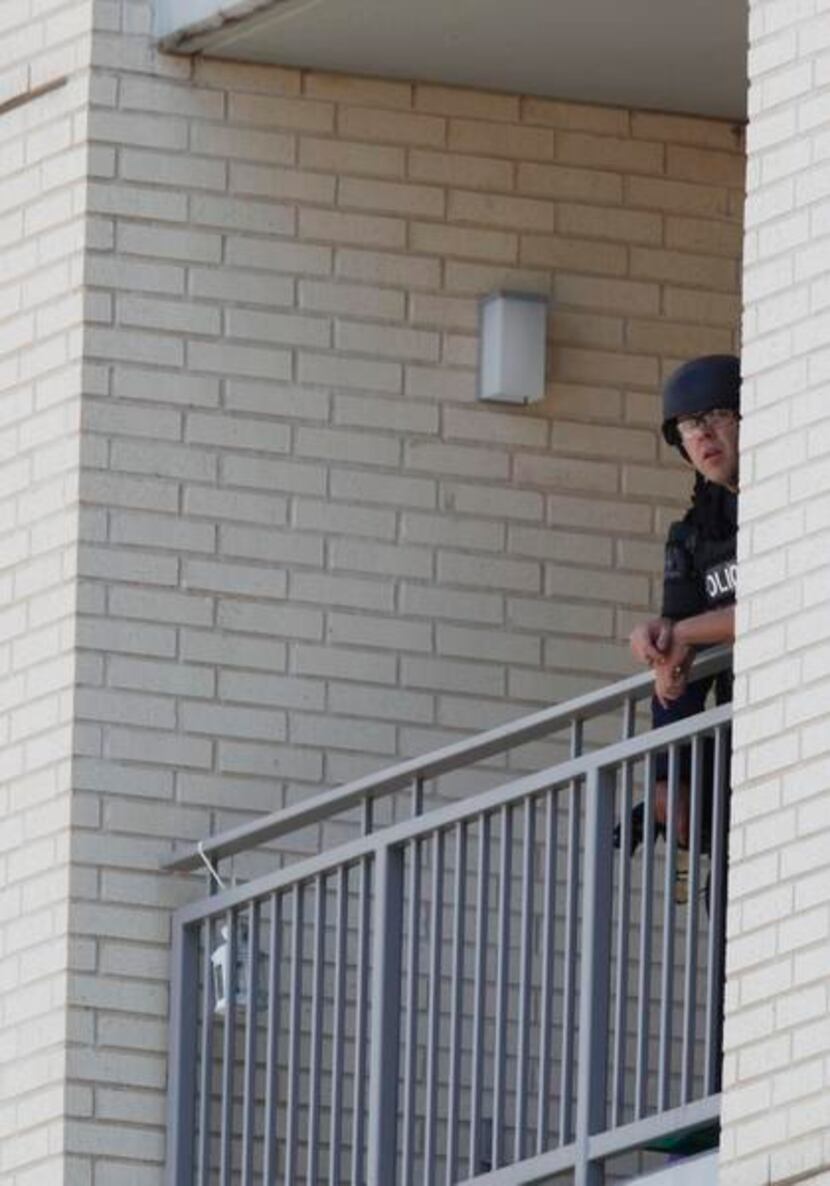 
Dallas SWAT team members observed the scene from a balcony.

