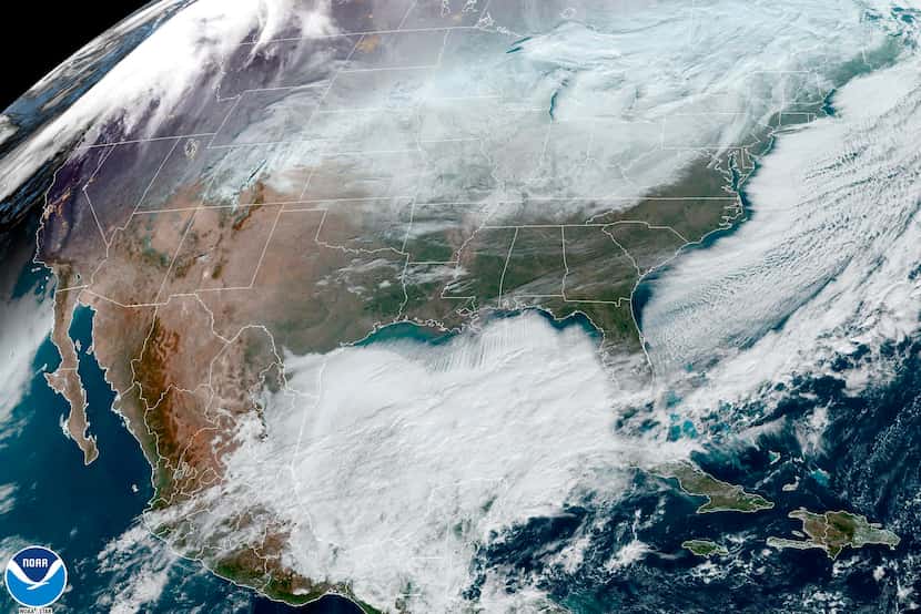 This satellite image made available by NOAA shows weather systems across North America on...