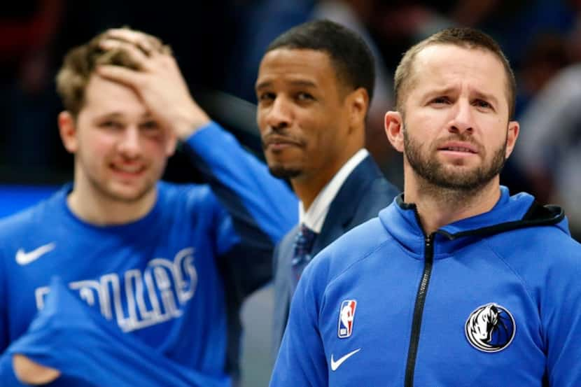 Dallas Mavericks guard J.J. Barea looks to someone he knows in the stands during a fourth...